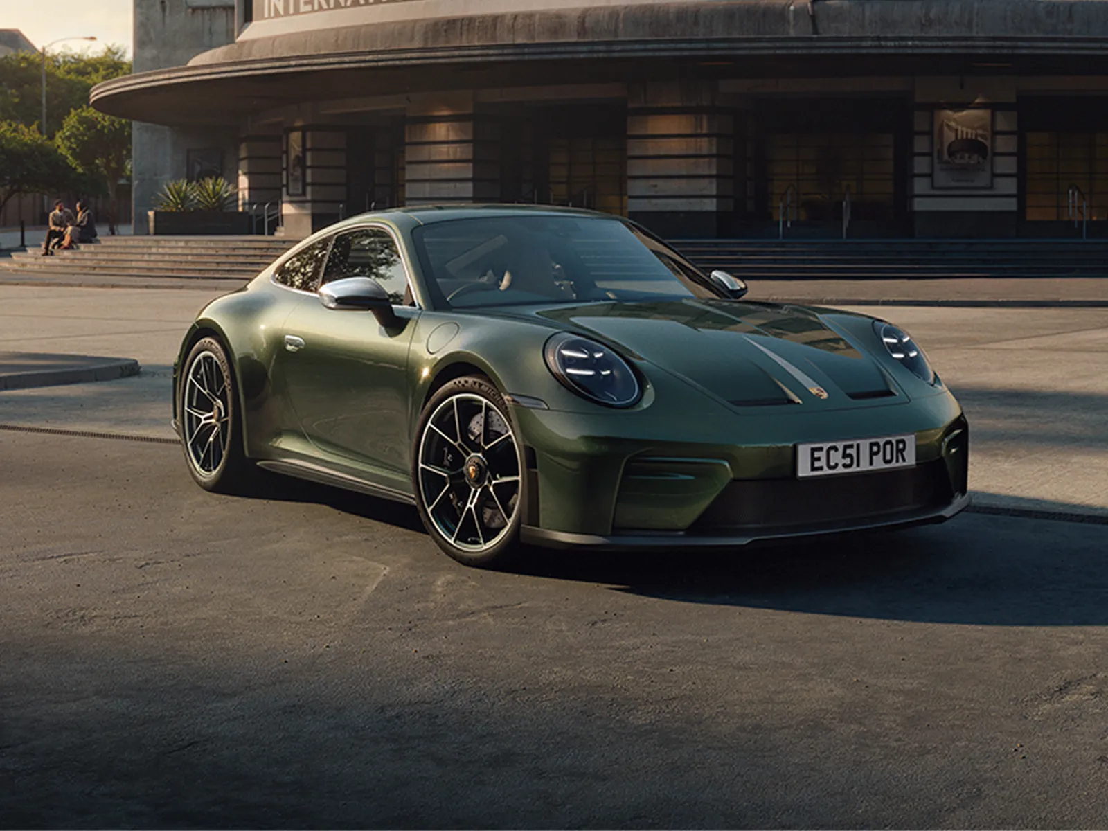 Green 911 Earls Court 51 car parked in front of the "International Motor Show" building.