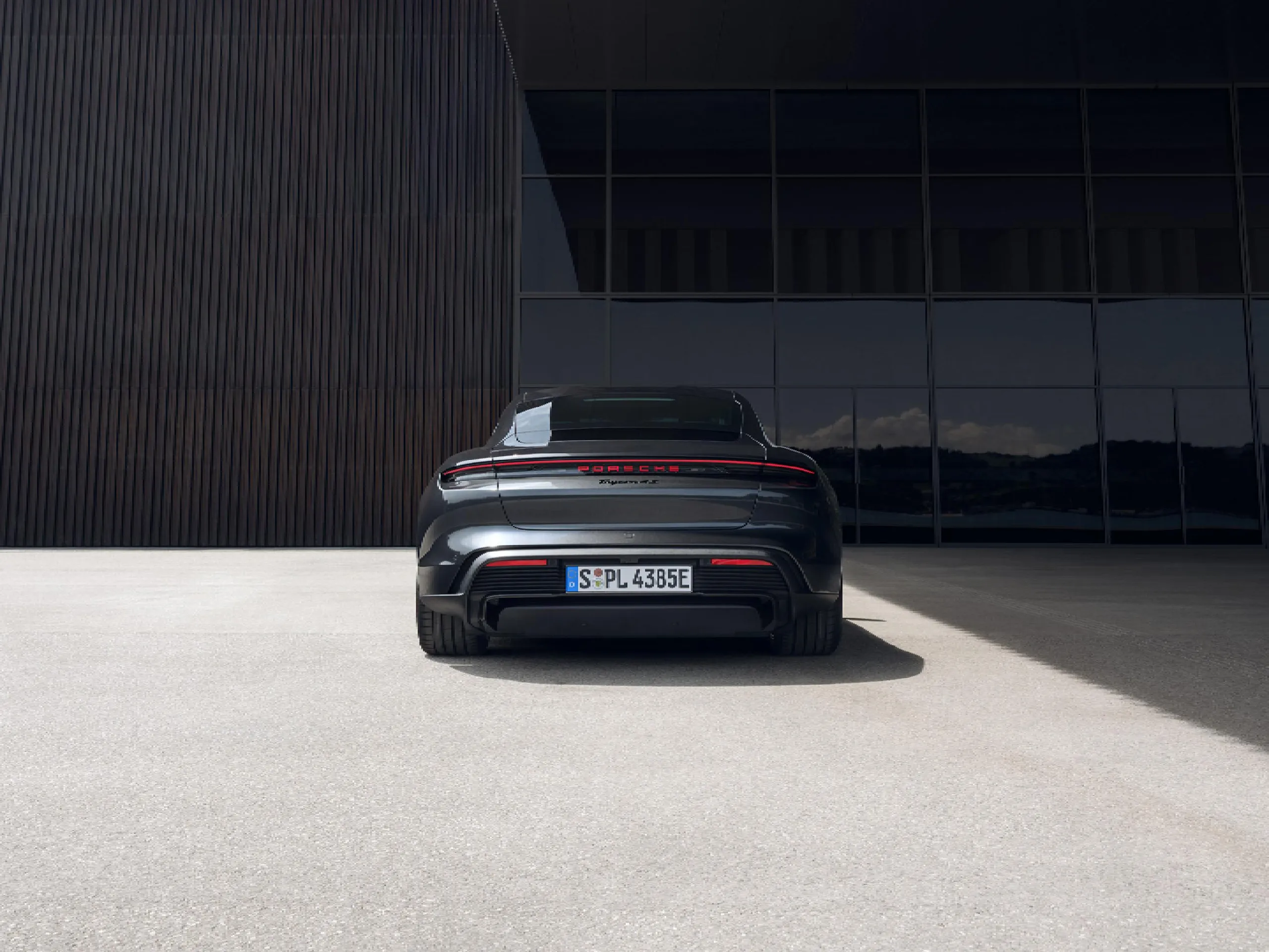 A rear image of a Porsche Taycan Black Edition.