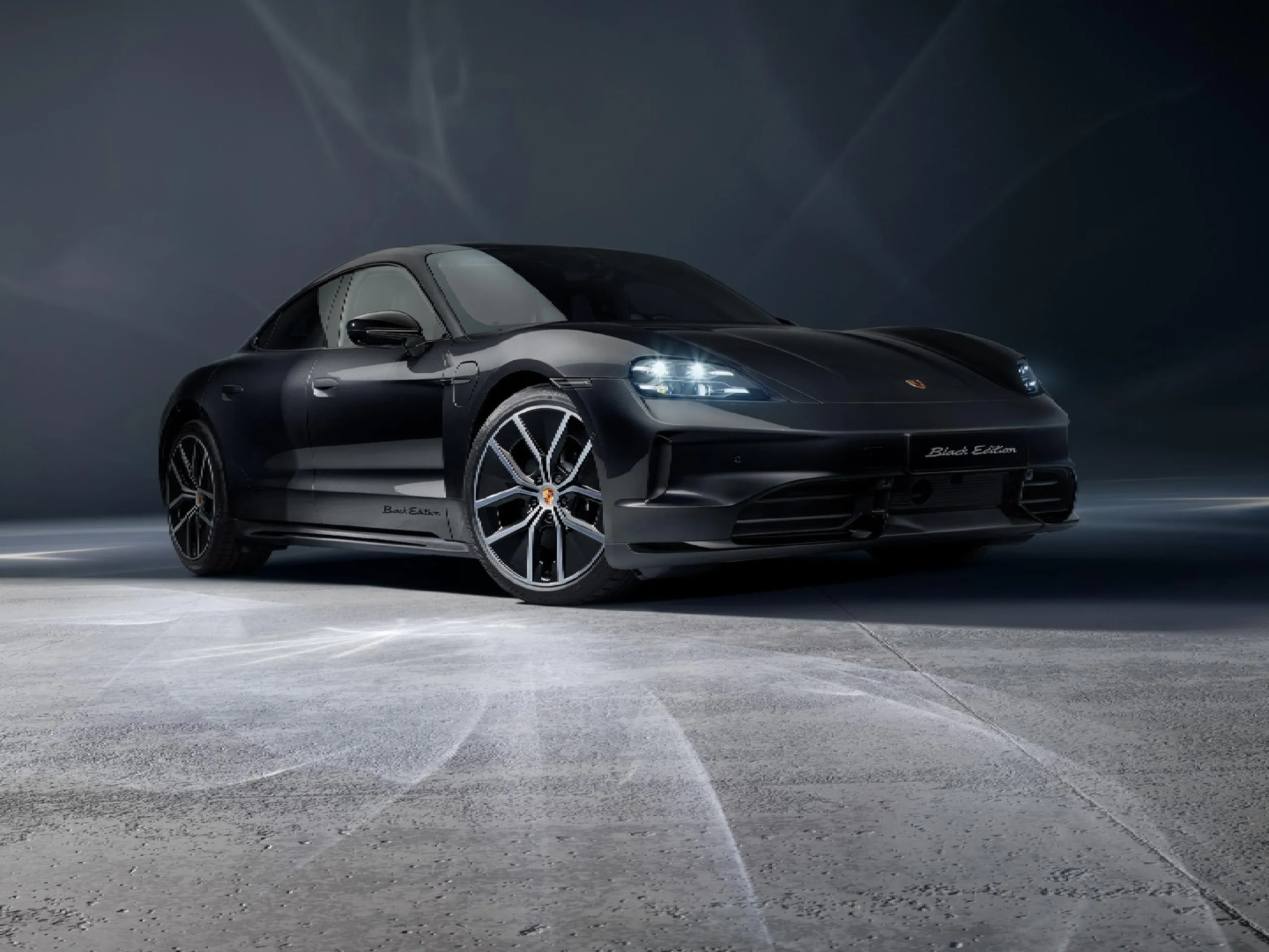 A rear image of a Porsche Taycan Black Edition.