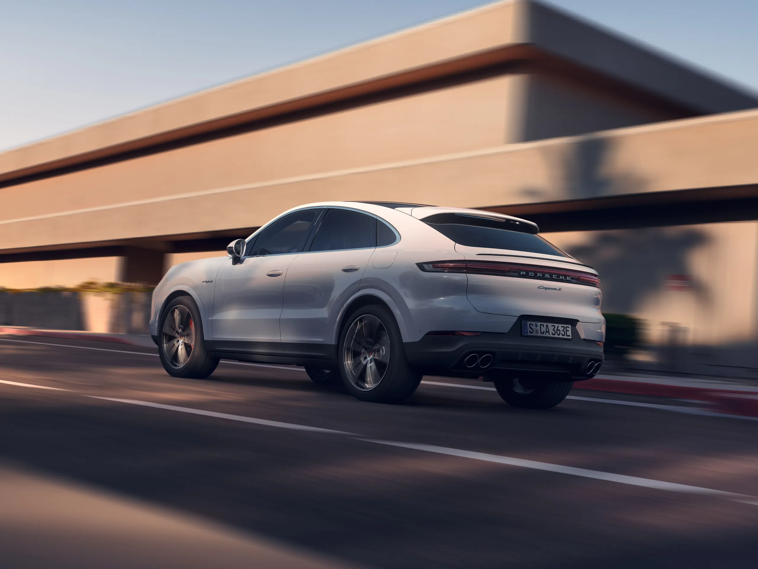 A shot of a white Cayenne in motion.
